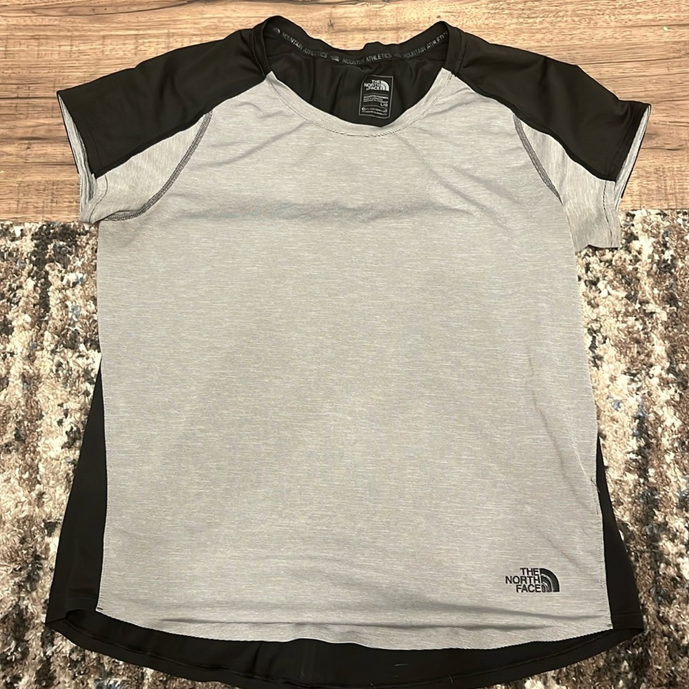 Sweat wicking, black and white stripped size L. Perfect for hiking, working out